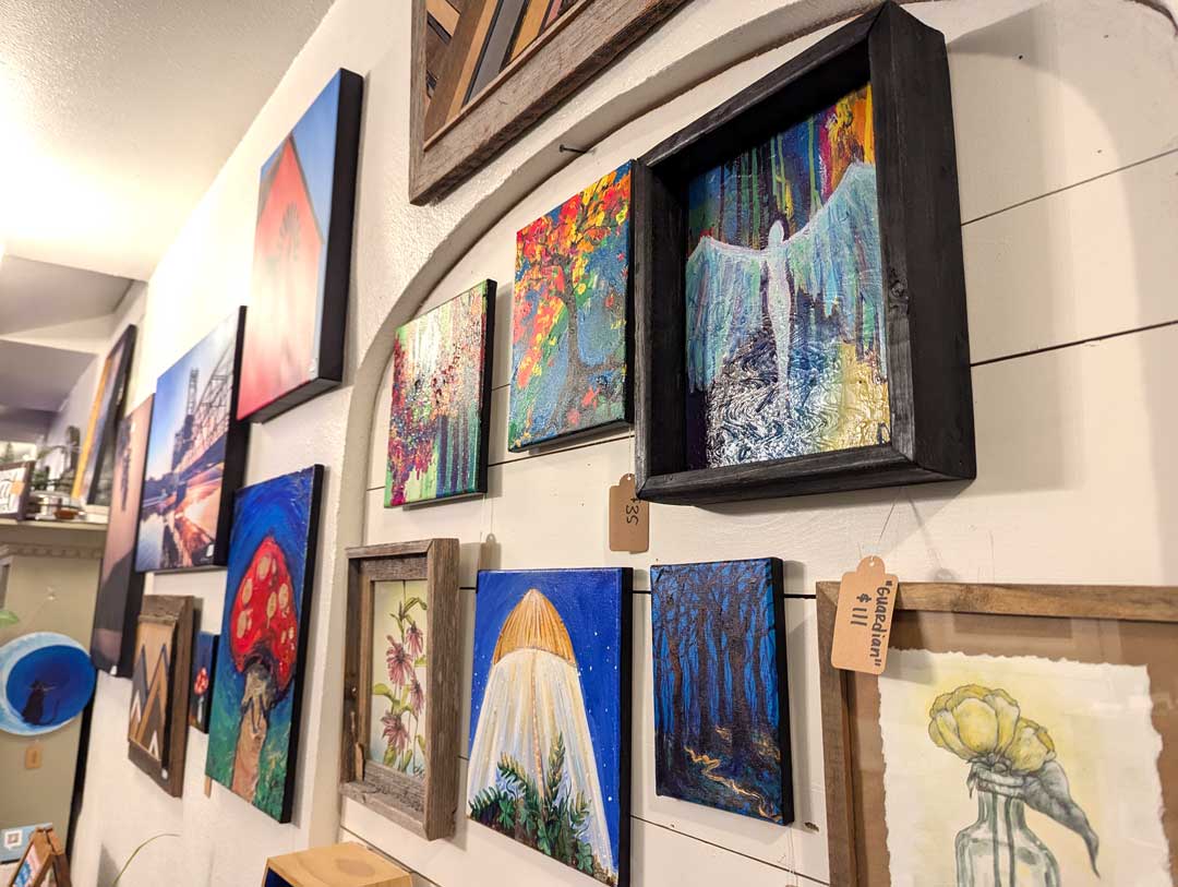 various types of art displayed on white wall
